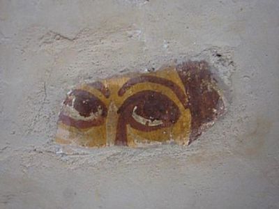 Image of a roman person's eyes peering out through some plaster